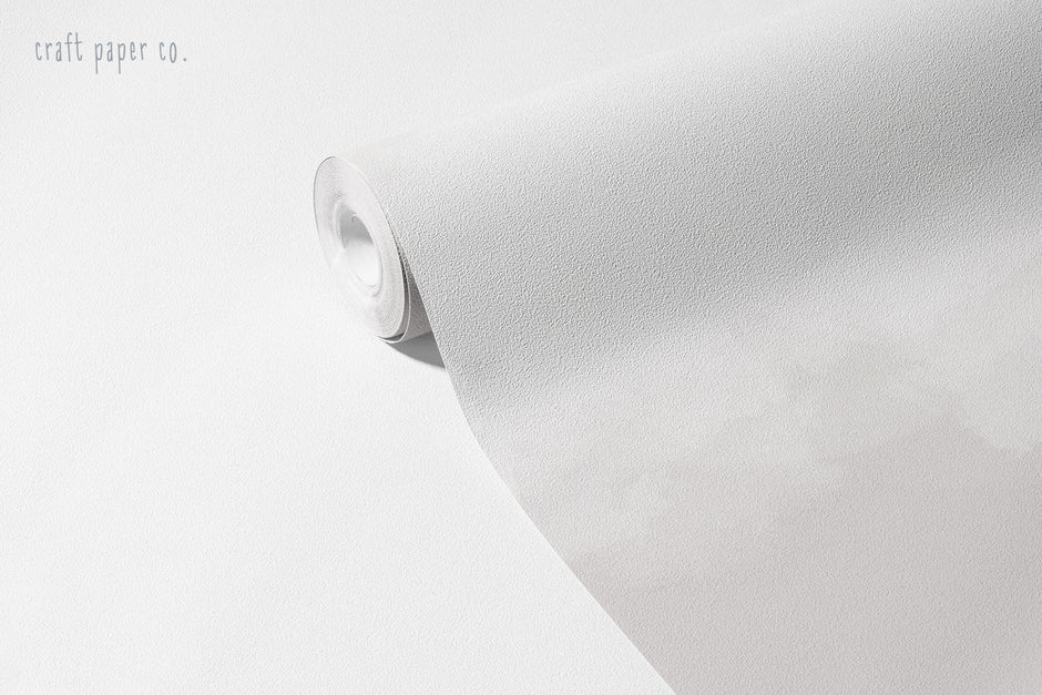 Clouds Wallpaper Mural in Paper (Greige); unrolled roll showing the soft greige cloud pattern | Craft Paper Co