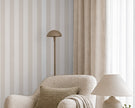 Striped Wallpaper Mural in Beige; close-up of beige stripes behind a cream armchair | Craft Paper Co