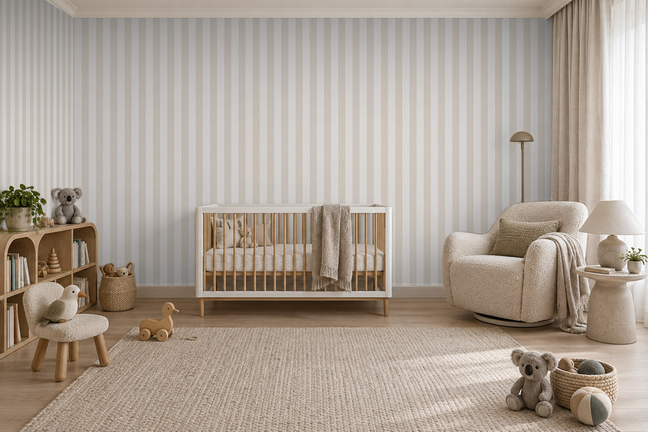 Striped Wallpaper Mural in Beige; beige stripes wrapping onto the side wall in a nursery with a crib | Craft Paper Co
