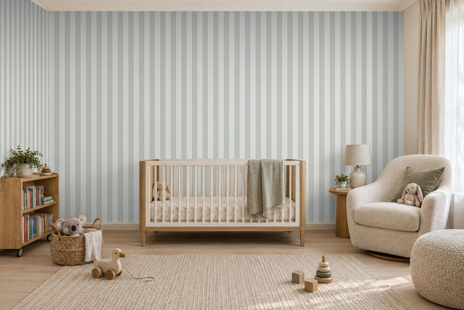 Striped Wallpaper Mural in Gnome Green; green stripes wrapping onto the side wall in a nursery with a wooden crib | Craft Paper Co