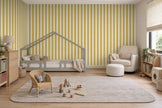Striped Wallpaper Mural in Mustard; mustard yellow stripes wrapping onto the side wall in a kids' room with a house bed | Craft Paper Co