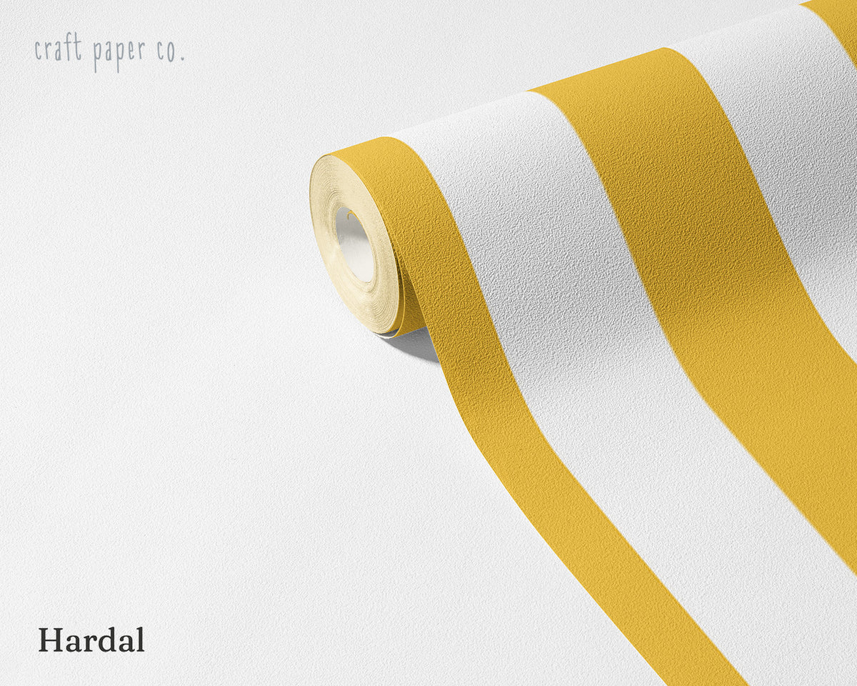Striped Wallpaper Mural in Mustard; unrolled roll showing mustard yellow stripes | Craft Paper Co