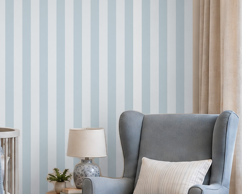 Striped Wallpaper Mural in Pool Blue; close-up of ice blue stripes behind a blue armchair and lamp | Craft Paper Co