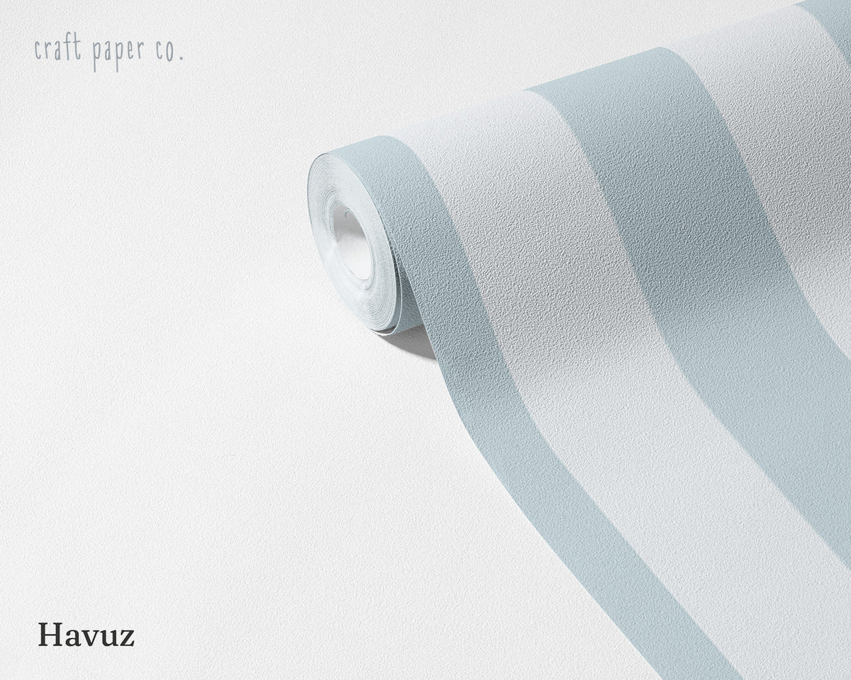 Striped Wallpaper Mural in Pool Blue; unrolled roll showing pool blue stripes | Craft Paper Co