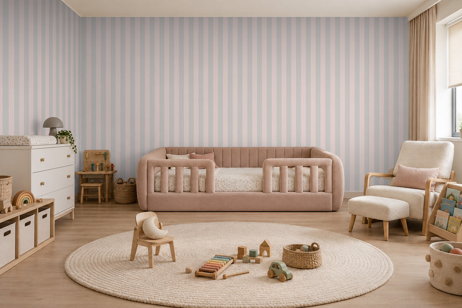 Striped Wallpaper Mural in Pink Grey; pink and gray stripes wrapping onto the side wall in a kids' room with a pink sofa | Craft Paper Co
