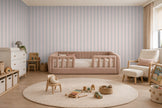 Striped Wallpaper Mural in Pink Grey; pink and gray stripes wrapping onto the side wall in a kids' room with a pink sofa | Craft Paper Co