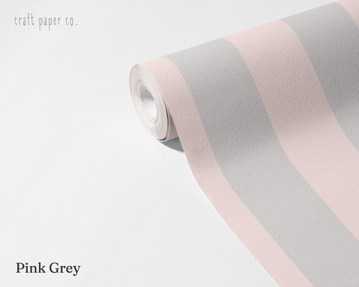 Striped Wallpaper Mural in Pink Grey; unrolled roll showing grayish pink stripes | Craft Paper Co
