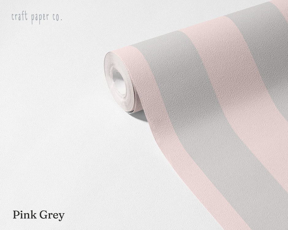 Striped Wallpaper Mural in Pink Grey; unrolled roll showing grayish pink stripes | Craft Paper Co