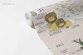 Classic World Map Wallpaper Mural in Greige; unrolled roll showing a lion family, a giraffe and African country names | Craft Paper Co