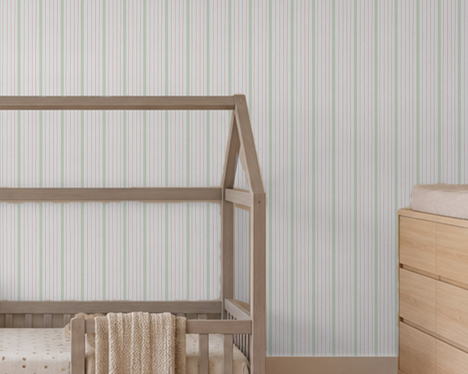 Thin Stripe Wallpaper Mural in Sage Green & Red; thin green and red stripes behind a house bed | Craft Paper Co