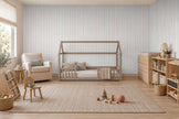Thin Stripe Wallpaper Mural in Sage Green & Red; thin stripes wrapping onto the side wall in a room with a house bed | Craft Paper Co