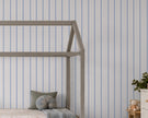 Thin Stripe Wallpaper Mural in Lilac Blue & Red; lilac-blue and red stripes behind a house bed | Craft Paper Co