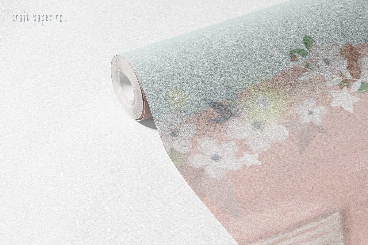 Little Mermaids Wallpaper Mural; unrolled roll showing a flower-trimmed whale and a mermaid tail | Craft Paper Co