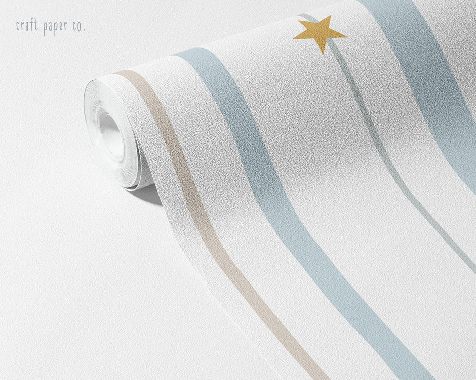 Blue & Beige Starry Stripe Wallpaper Mural; blue-beige stripes and a mustard-yellow star on an unrolled roll | Craft Paper Co