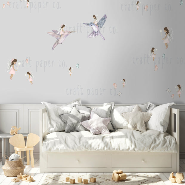 Periler, Kuşlar ve Kelebekler Duvar Sticker; beyaz kanepenin üstünde duvarda periler ve kuşlar | Craft Paper Co