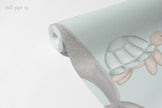 Blonde Mermaid and Friends Wallpaper Mural; unrolled roll showing a mermaid tail and a turtle | Craft Paper Co